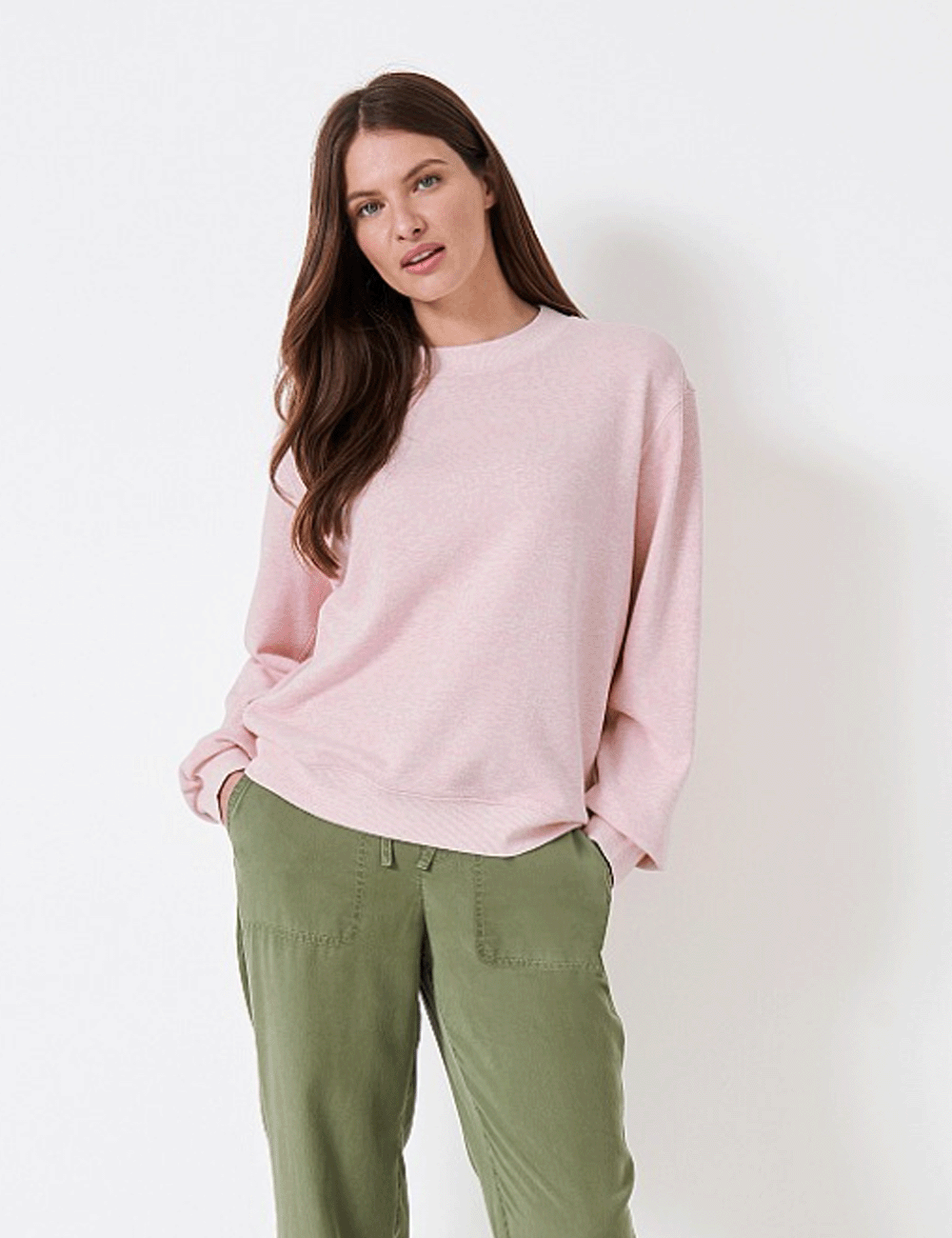 Woman wearing the Crew Clothing Essential Oversized Sweatshirt with khaki trousers