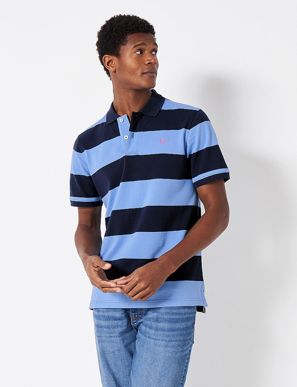 Man wearing the Heritage Stripe Polo Shirt with jeans