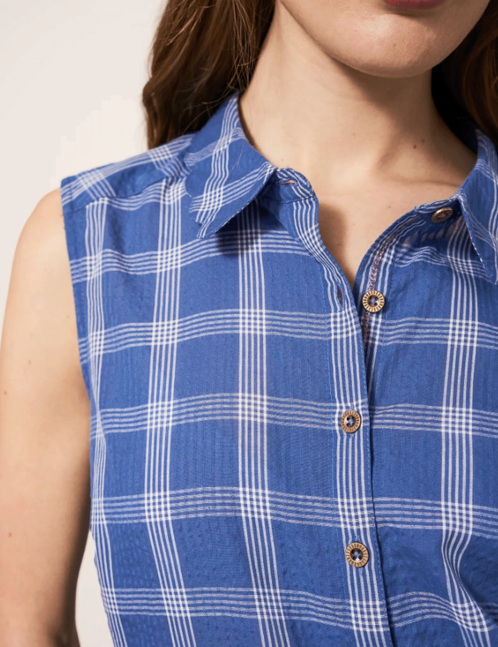 Close up at the neckline of woman wearing the Lizzie Check Shirt