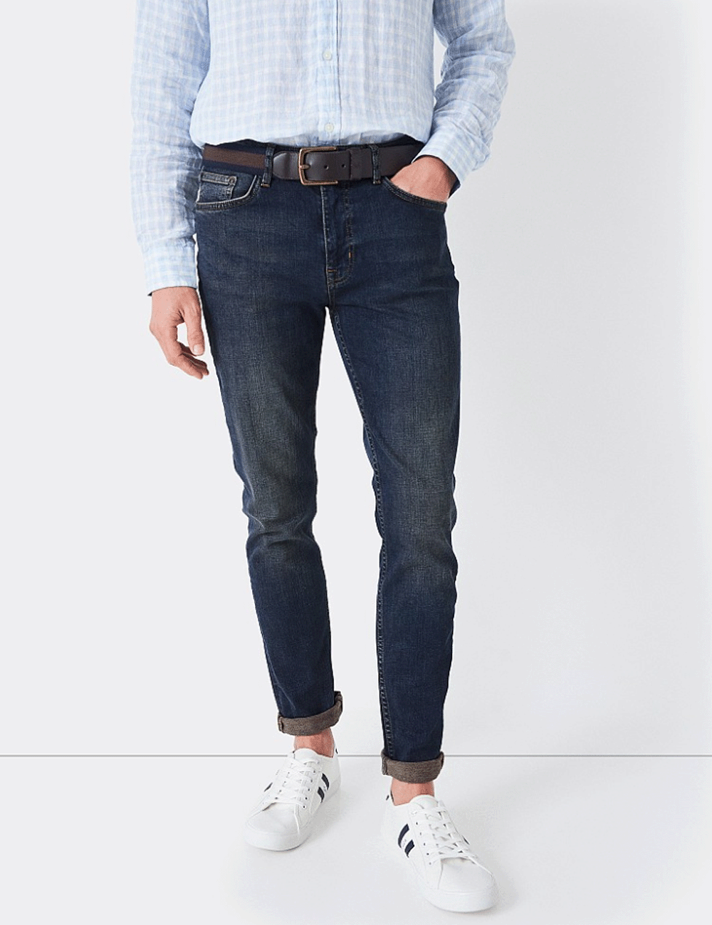 Man wearing the Spencer Jeans from Crew Clothing with a shirt and trainers