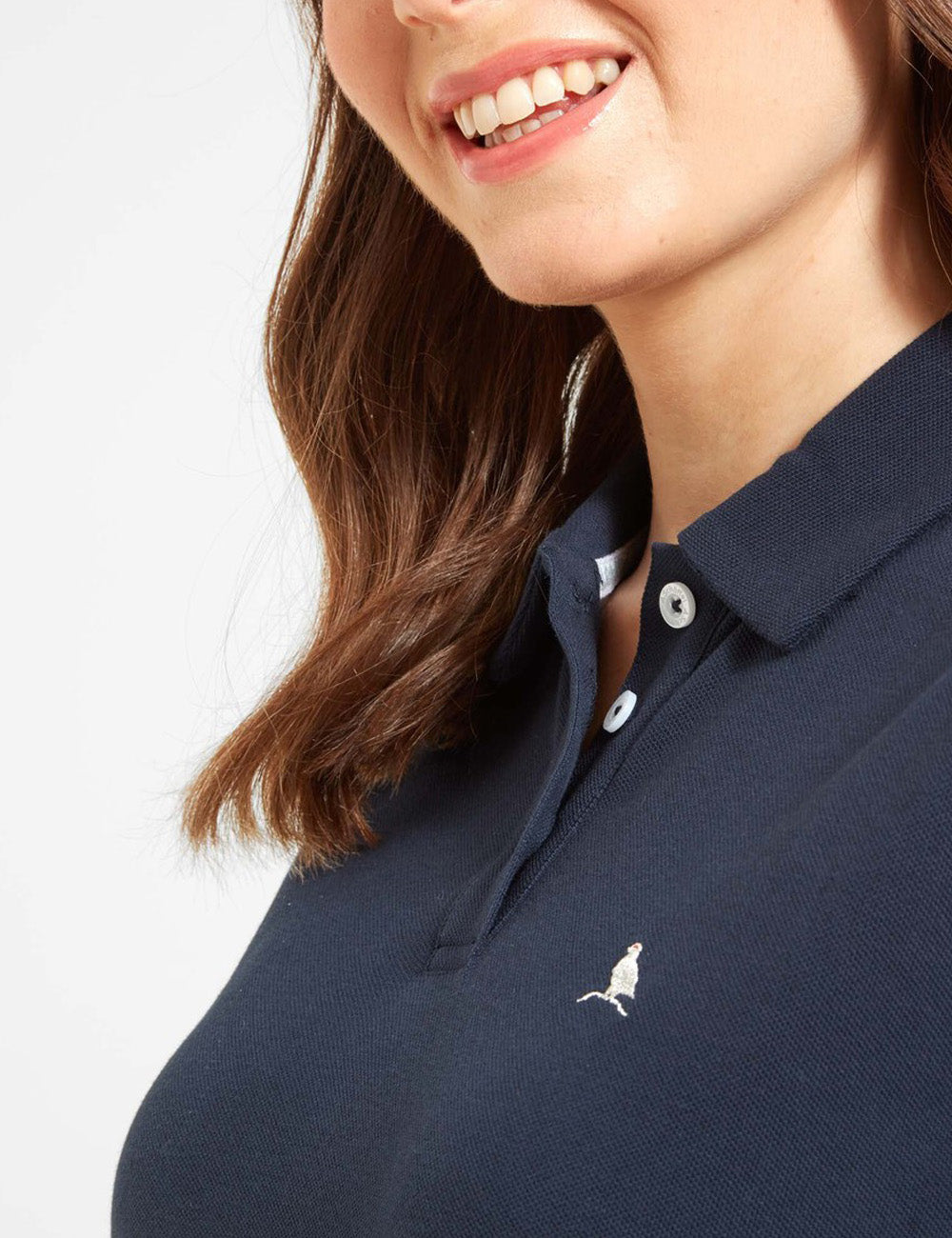 Close up at the neckline of woman wearing the St. Ives Polo Dress