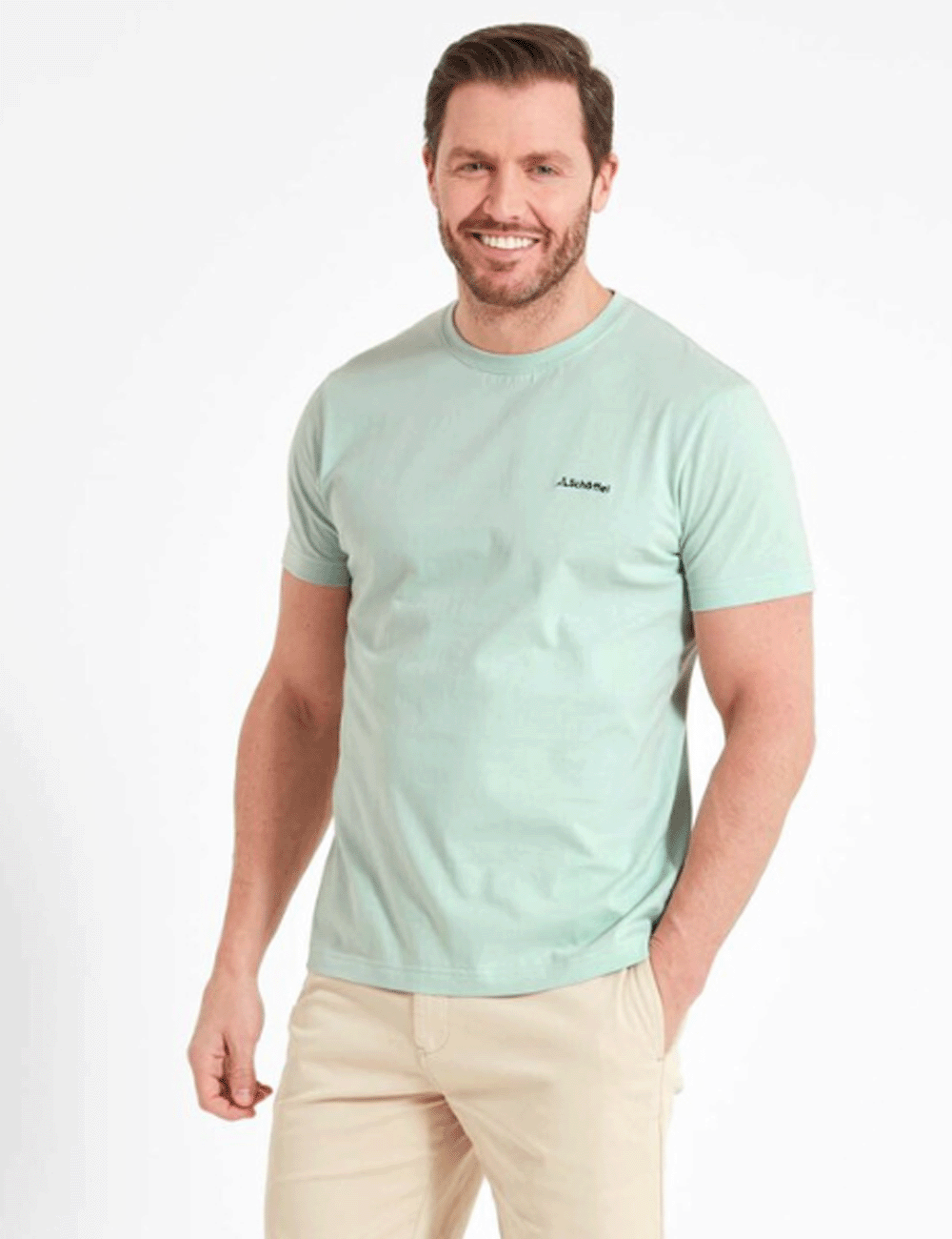 Man wearing the Trevone T-Shirt with beige shorts, his left hand in the front pocket