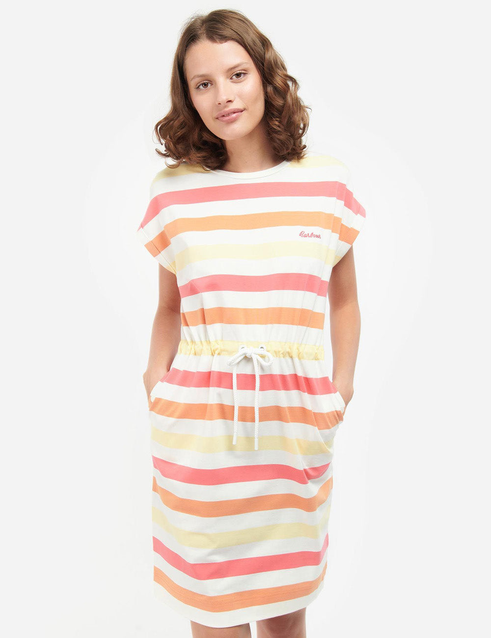 Woman wearing the Barbour Marloes Stripe Dress with her hands in the side pockets