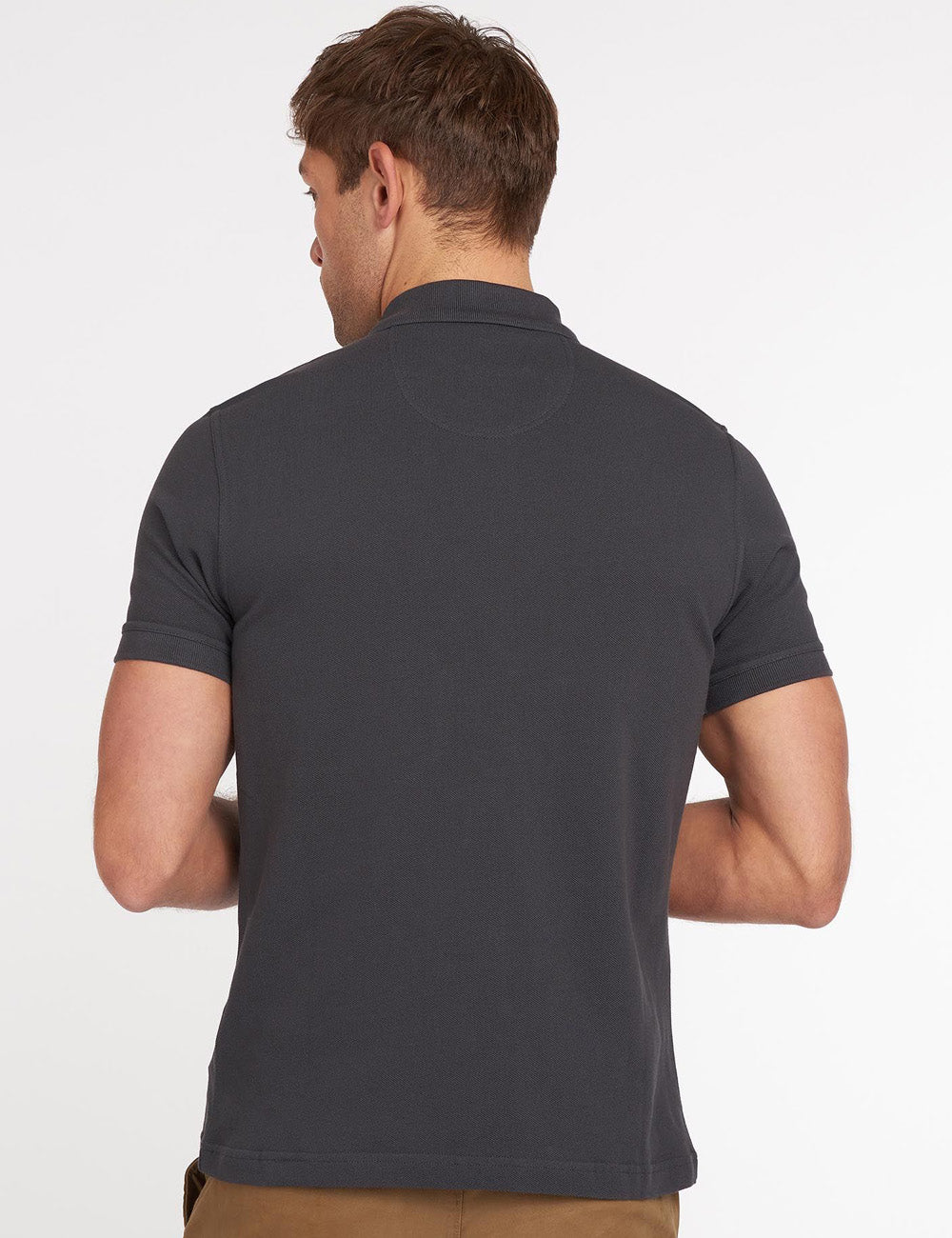 Man faced away wearing the Sports Polo