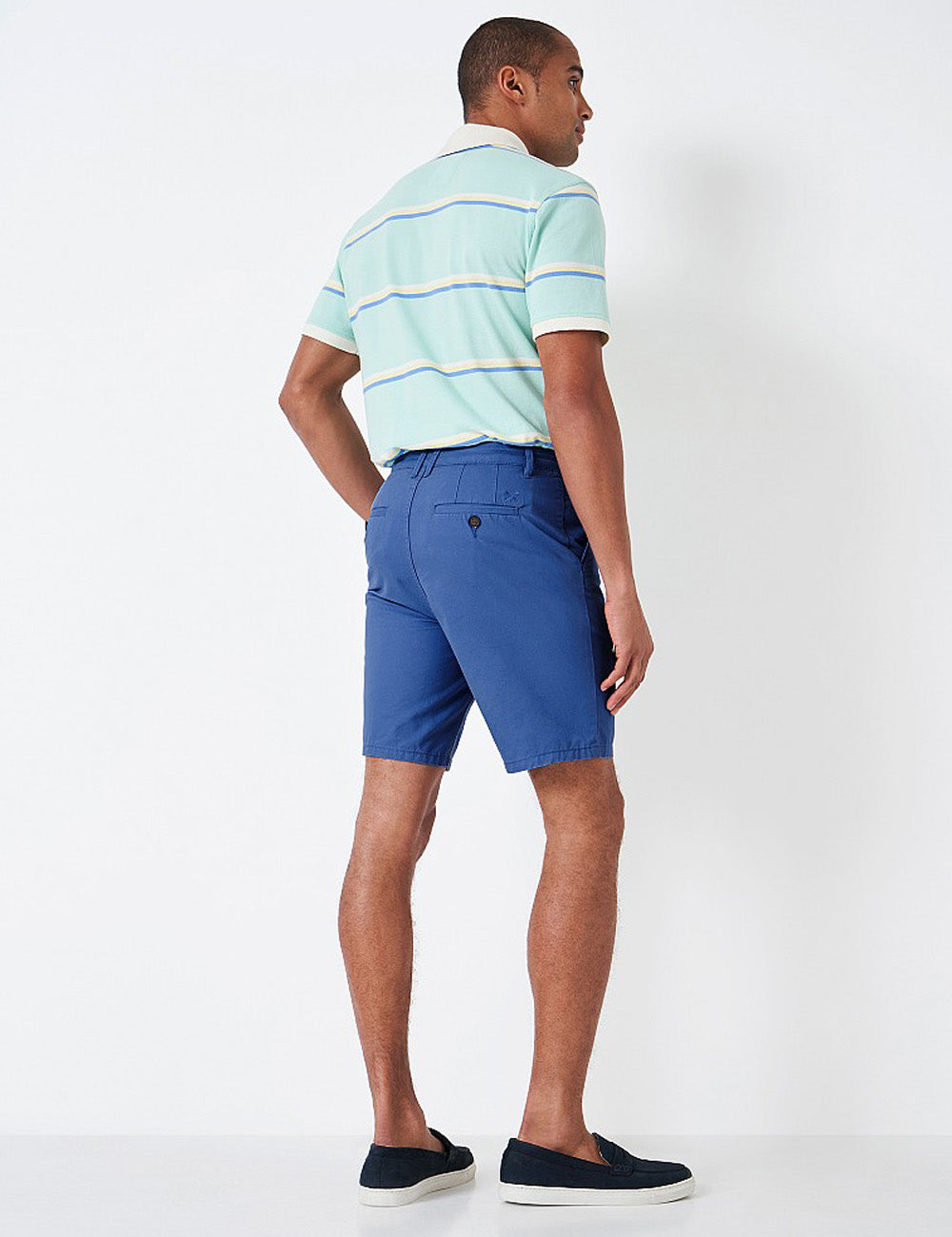 Man wearing the Bermuda Shorts with a polo shirt tucked in, facing away