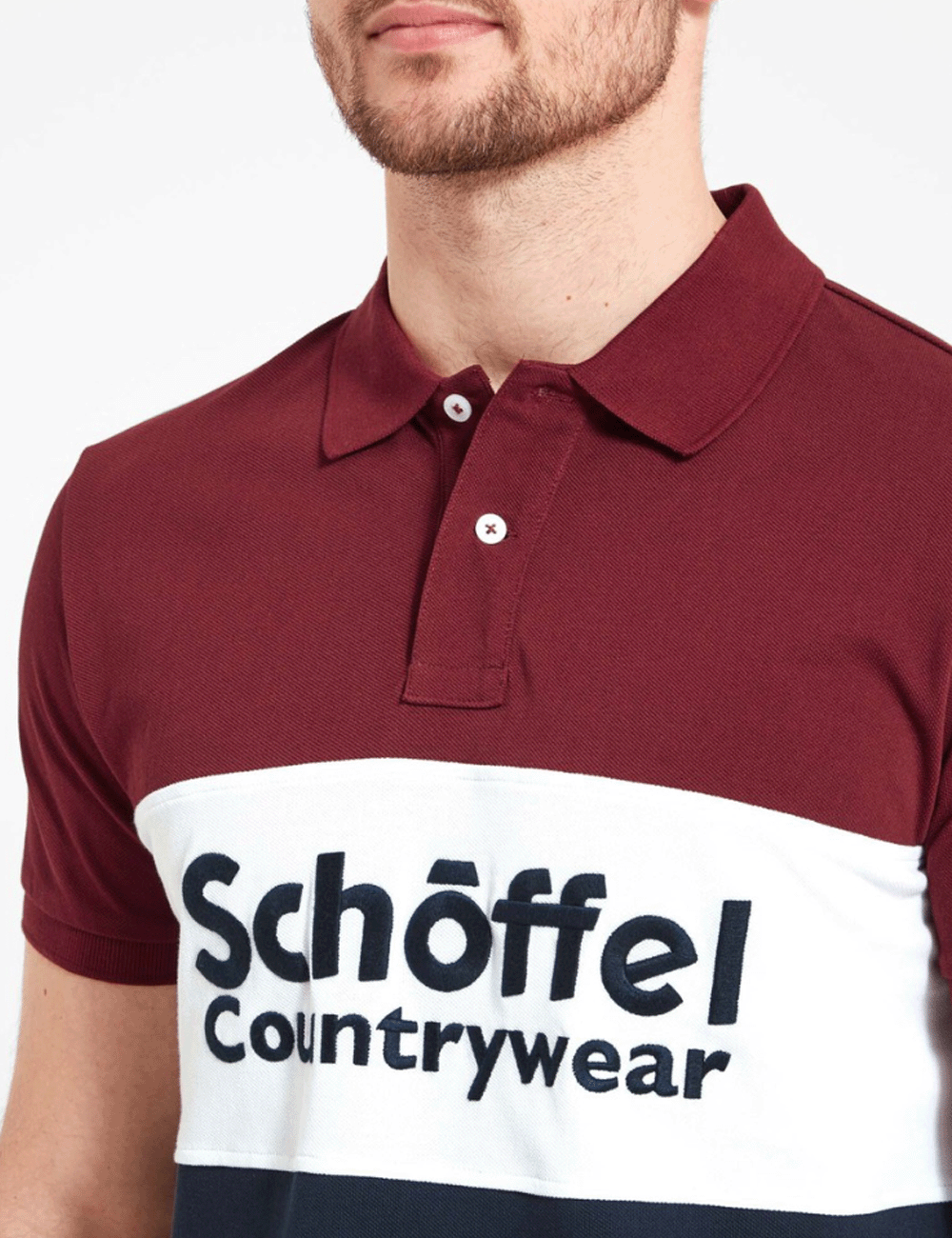 Close up of man wearing the Exeter Heritage Polo Shirt