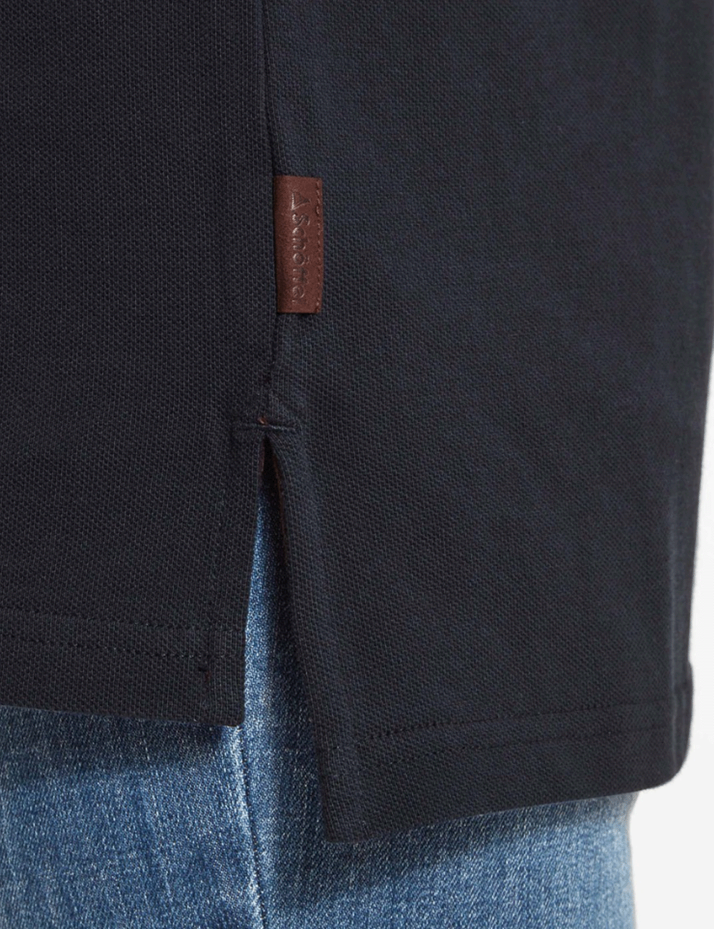 Close up of the Schoffel suede label on the seam of the Exeter Polo Shirt