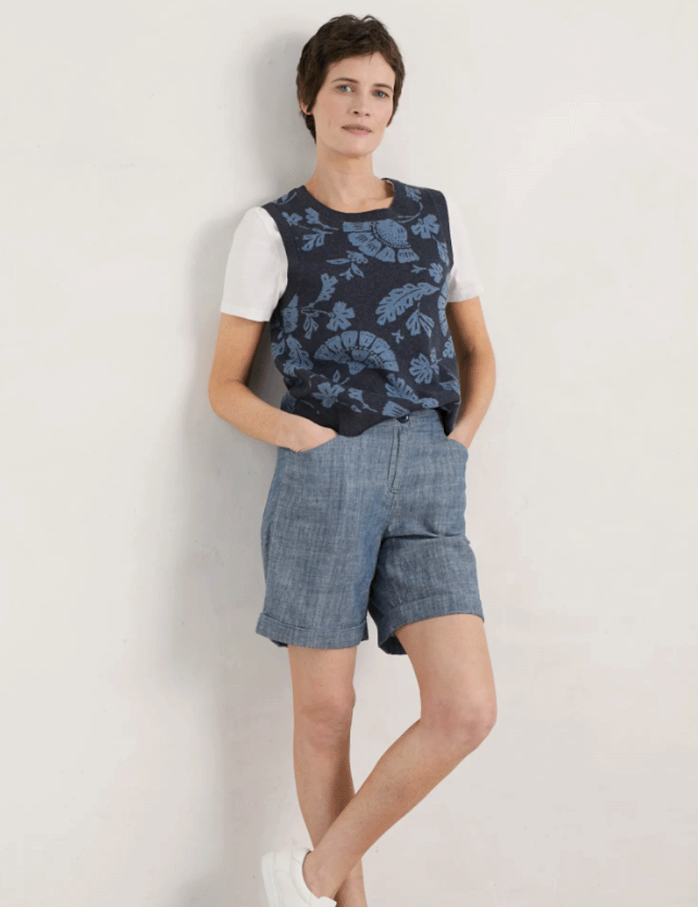 Woman wearing the Penderleith Shorts with a navy vest top