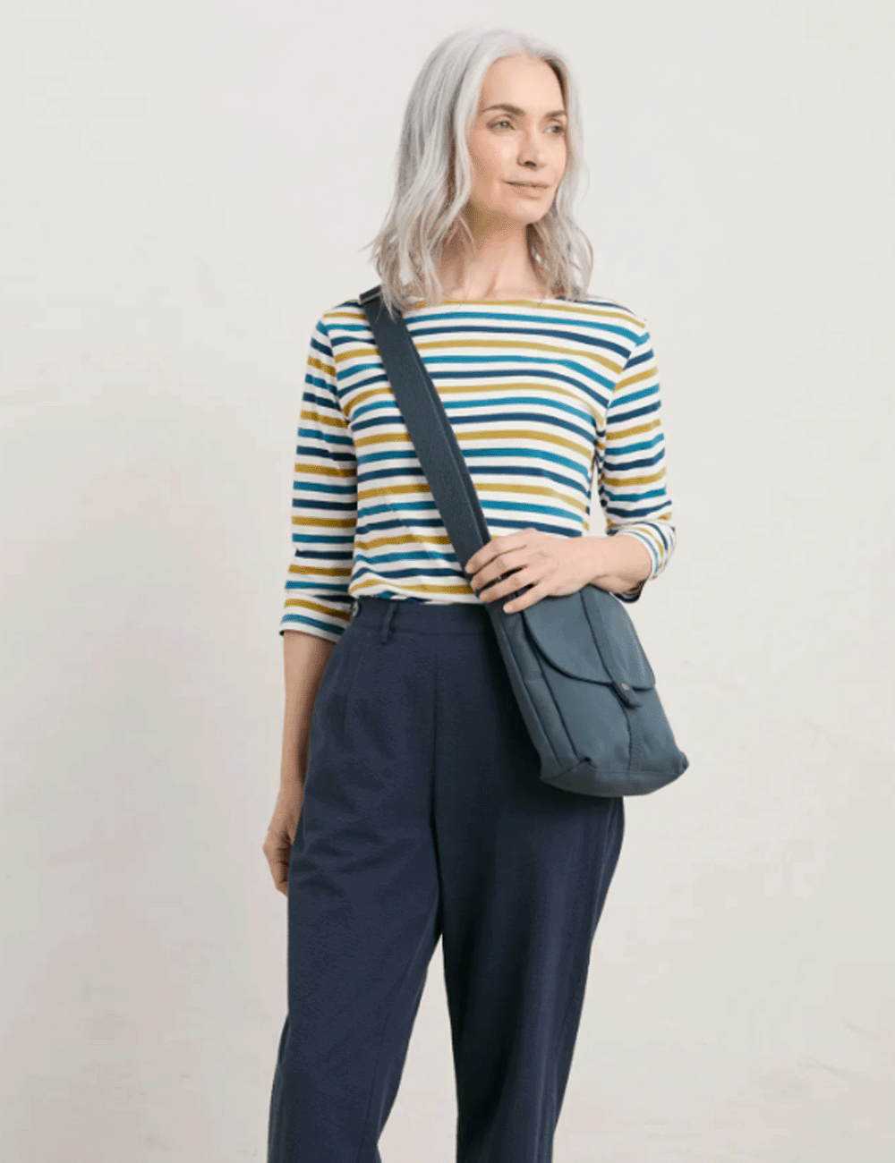 Woman wearing the Sailor Top with navy trousers and a blue crossbody bag over her shoulder
