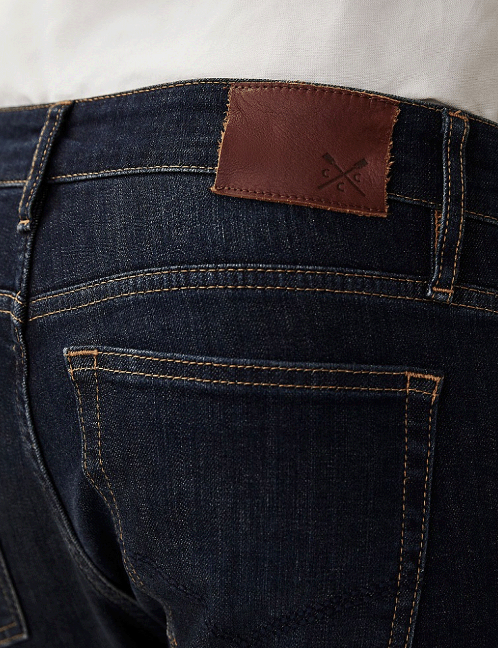 Close up leather branded patch on the back of the Spencer Jeans
