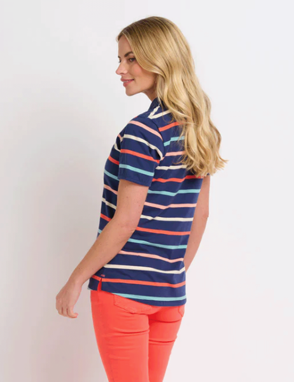 Woman facing away wearing the Stripe Polo Shirt