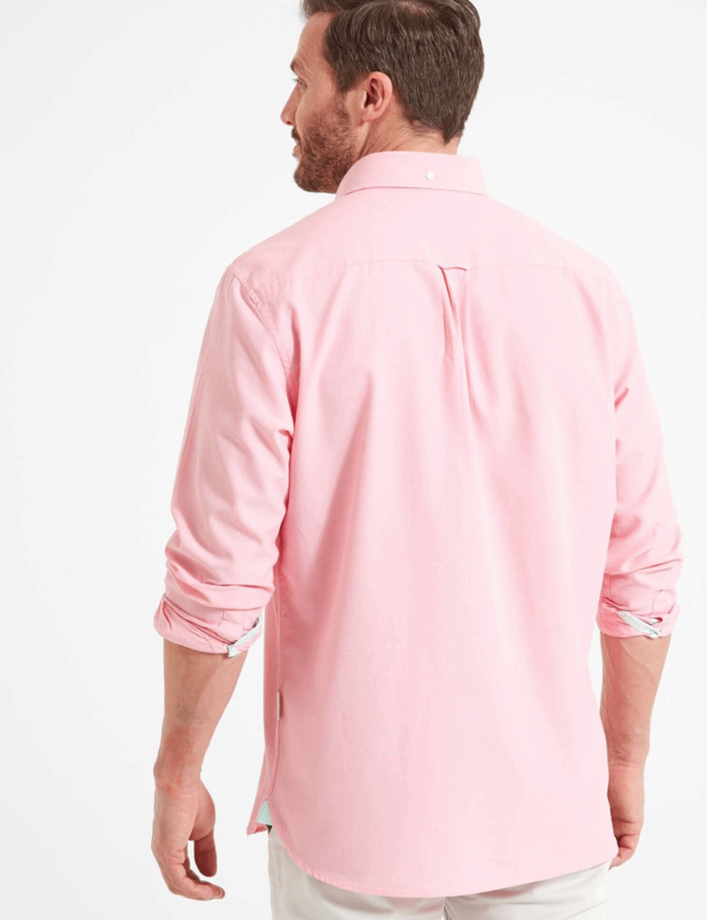 Man facing away wearing the Titchwell Shirt in Flamingo