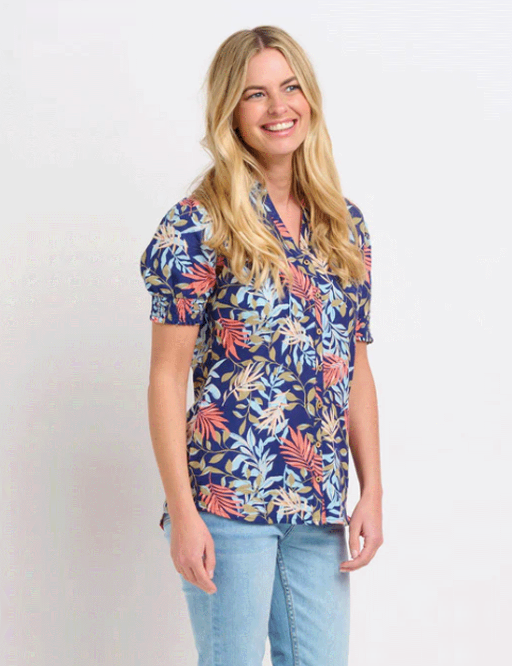 Woman wearing the Trailing Tropics Blouse with jeans