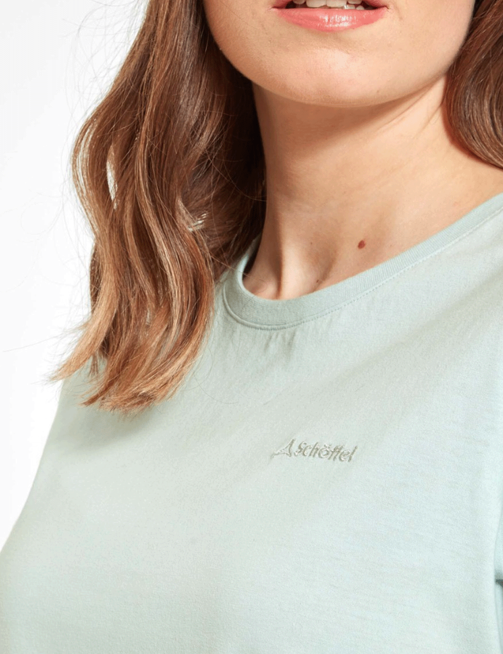 Close up at the neckline of woman wearing the Tresco T-Shirt