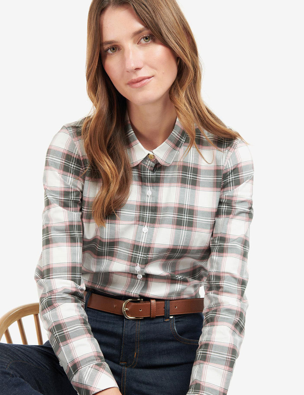 Woman sitting down wearing the Barbour Daphne Checked Shirt