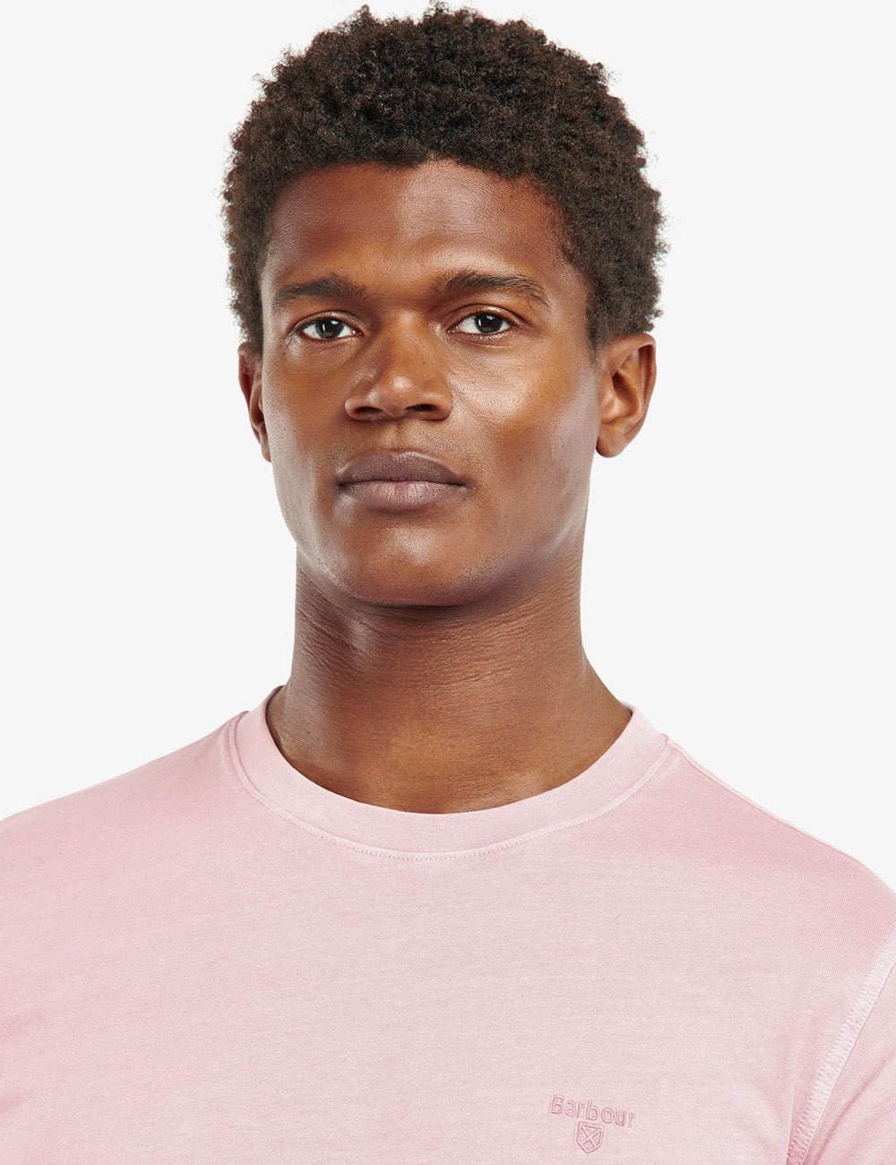 Close up of man wearing the garment Dyed T-Shirt at the neckline