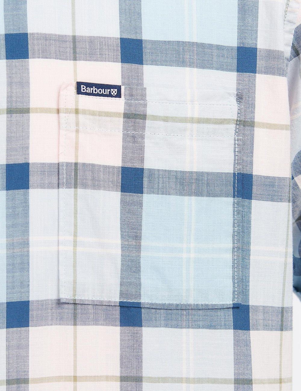 Close up of patch pocket and Barbour branded label on the left chest of the shirt