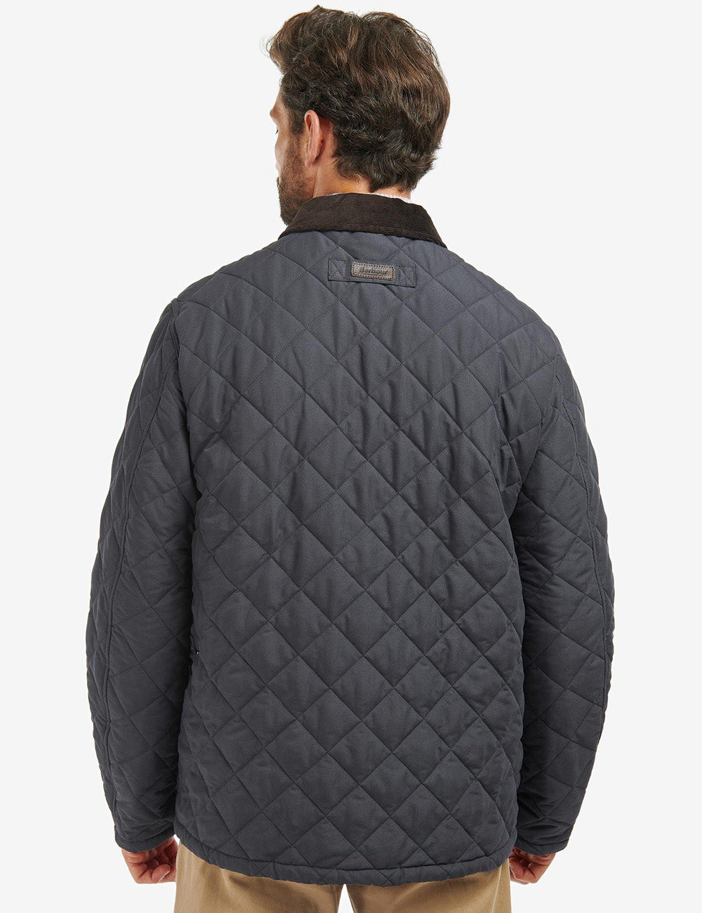 Image from the back of man wearing the Horsley Jacket