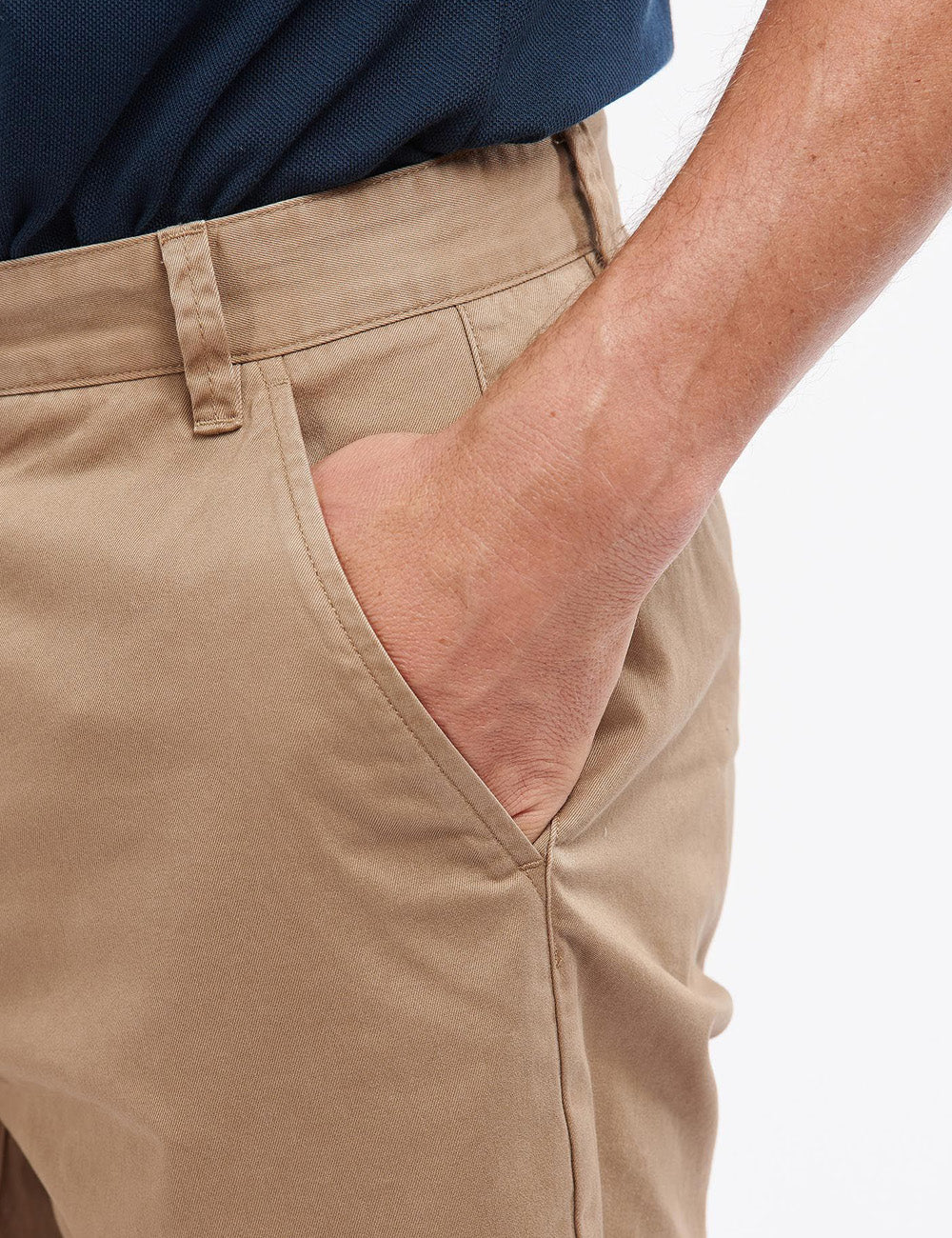 Close up of man wearing the Neuston shorts with his hand in the left pocket
