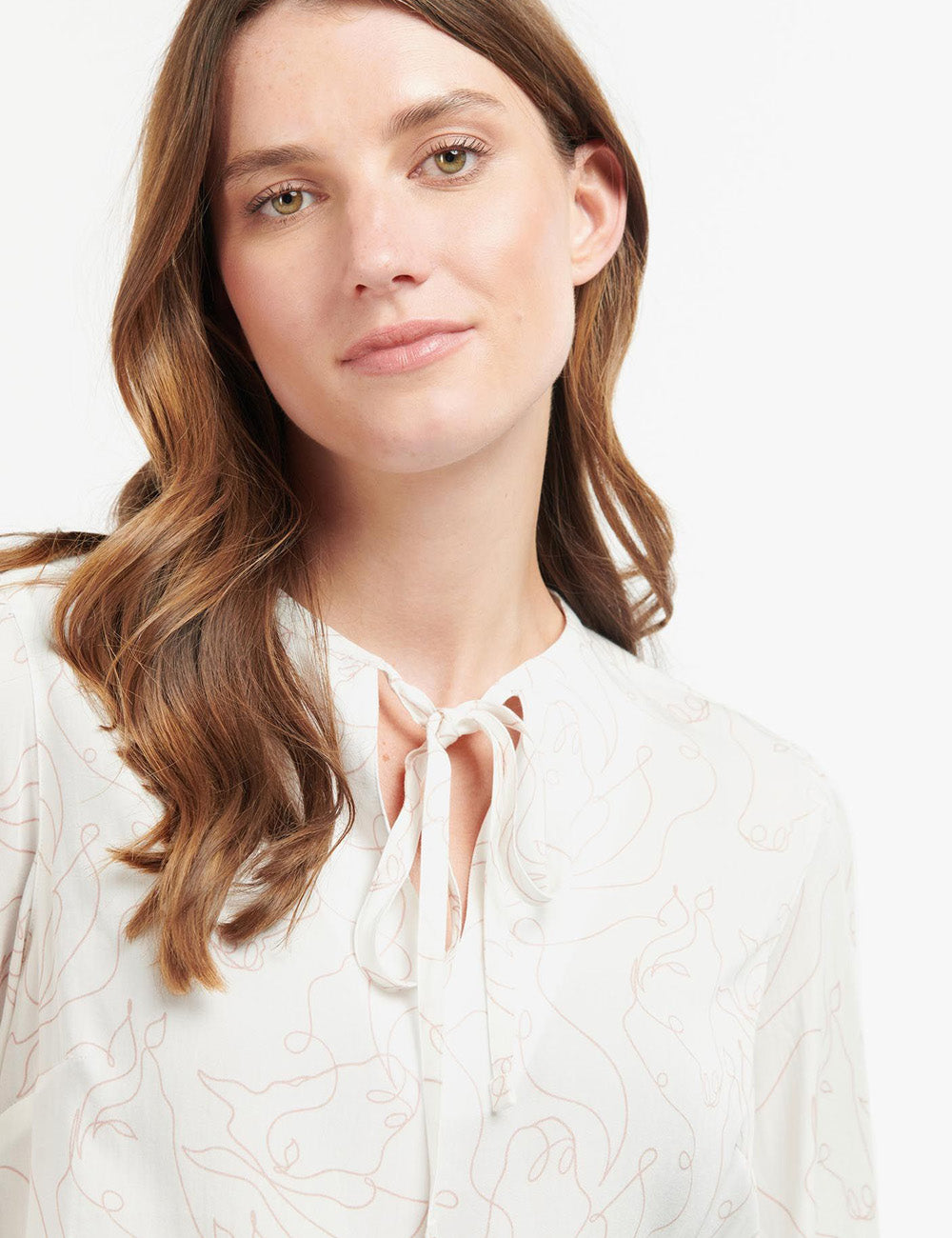 Close up of woman wearing the Regia Top at the neckline