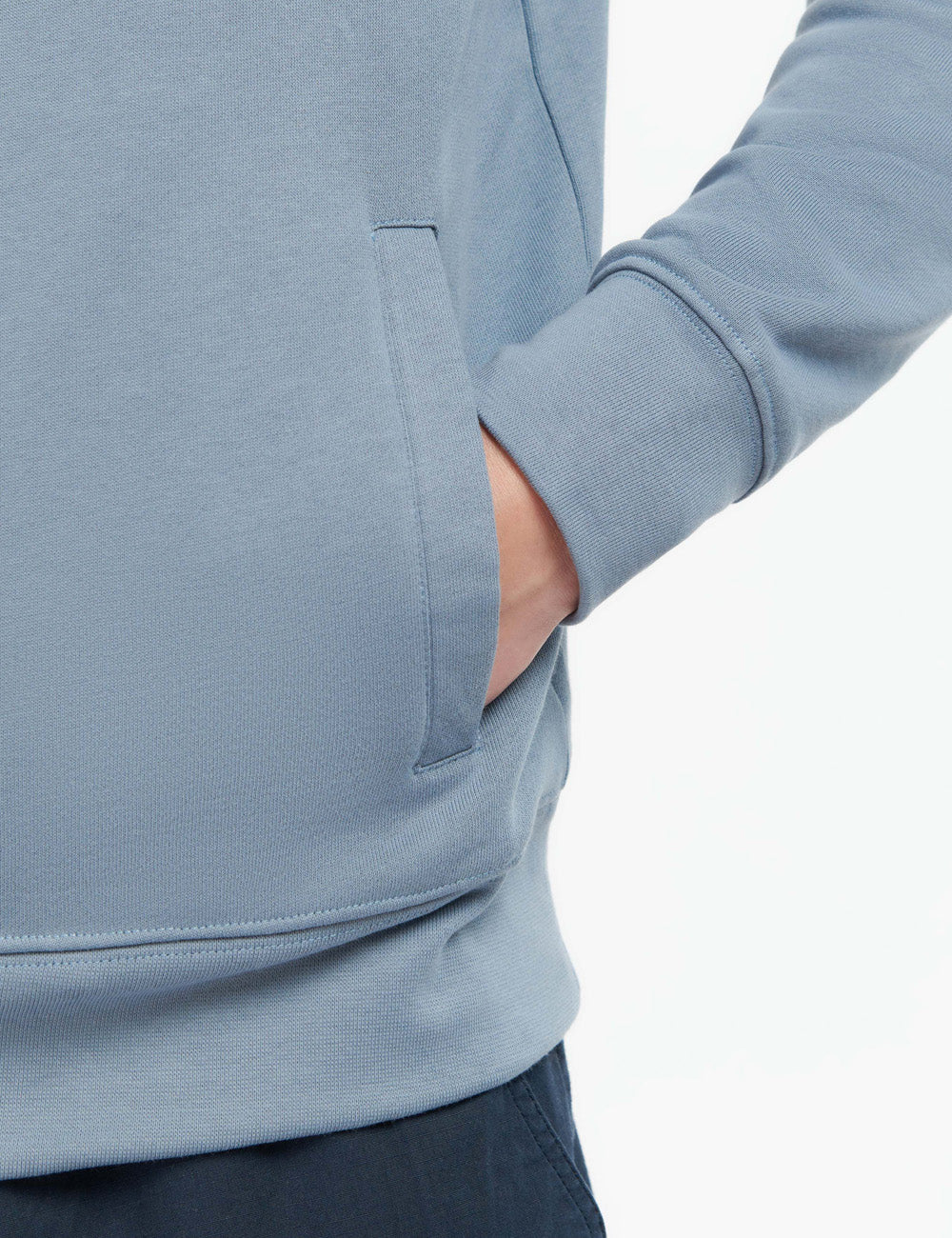 Close up of man wearing the Rothley Sweatshirt with his hand in the left side pocket