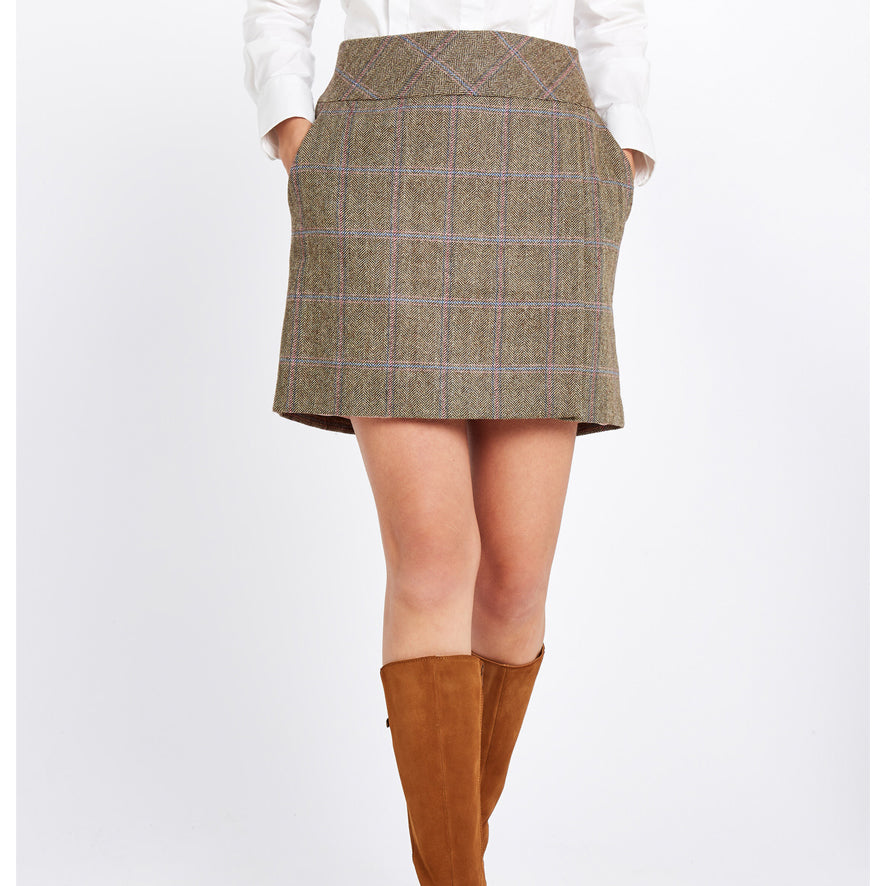 Dubarry boots worn with a tweed mini skirt and pink gilet - we